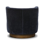 Featuring Dottie Monte Navy Swivel Chair by Four Hands at Amethyst Home. The continuous form of this swivel chair creates a sleek look that elevates everyday seating. Upholstered in navy wool blend, its sleek design is complemented by a 360-degree swivel and pedestal base of solid parawood for a mixed media moment. Overall Dimensions: 29.00"w x 33.75"d x 2. Amethyst Home provides interior design, new home construction design consulting, vintage area rugs, and lighting in the Des Moines metro area.