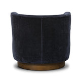 Featuring Dottie Monte Navy Swivel Chair by Four Hands at Amethyst Home. The continuous form of this swivel chair creates a sleek look that elevates everyday seating. Upholstered in navy wool blend, its sleek design is complemented by a 360-degree swivel and pedestal base of solid parawood for a mixed media moment. Overall Dimensions: 29.00"w x 33.75"d x 2. Amethyst Home provides interior design, new home construction design consulting, vintage area rugs, and lighting in the Des Moines metro area.