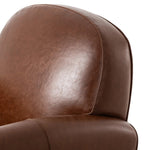 The popular Art Deco club chair makes a comeback. With a prominent curved top, deep seat with a loose cushion, and armrests designed for true relaxation, the armchair invites you to sit back and take it all in. Upholstered in rich mahogany top-grain leather. Amethyst Home provides interior design, new home construction design consulting, vintage area rugs, and lighting in the Miami metro area.