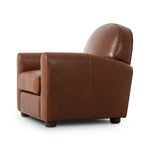 The popular Art Deco club chair makes a comeback. With a prominent curved top, deep seat with a loose cushion, and armrests designed for true relaxation, the armchair invites you to sit back and take it all in. Upholstered in rich mahogany top-grain leather. Amethyst Home provides interior design, new home construction design consulting, vintage area rugs, and lighting in the Park City metro area.