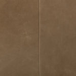 A modernized midcentury silhouette meets the traditional Chesterfield sofa, all in a compact profile perfect for smaller spaces. Top-grain leather in a tan hue, button tufting and a smooth touch bring deep comfort to lounging Amethyst Home provides interior design, new home construction design consulting, vintage area rugs, and lighting in the Alpharetta metro area.