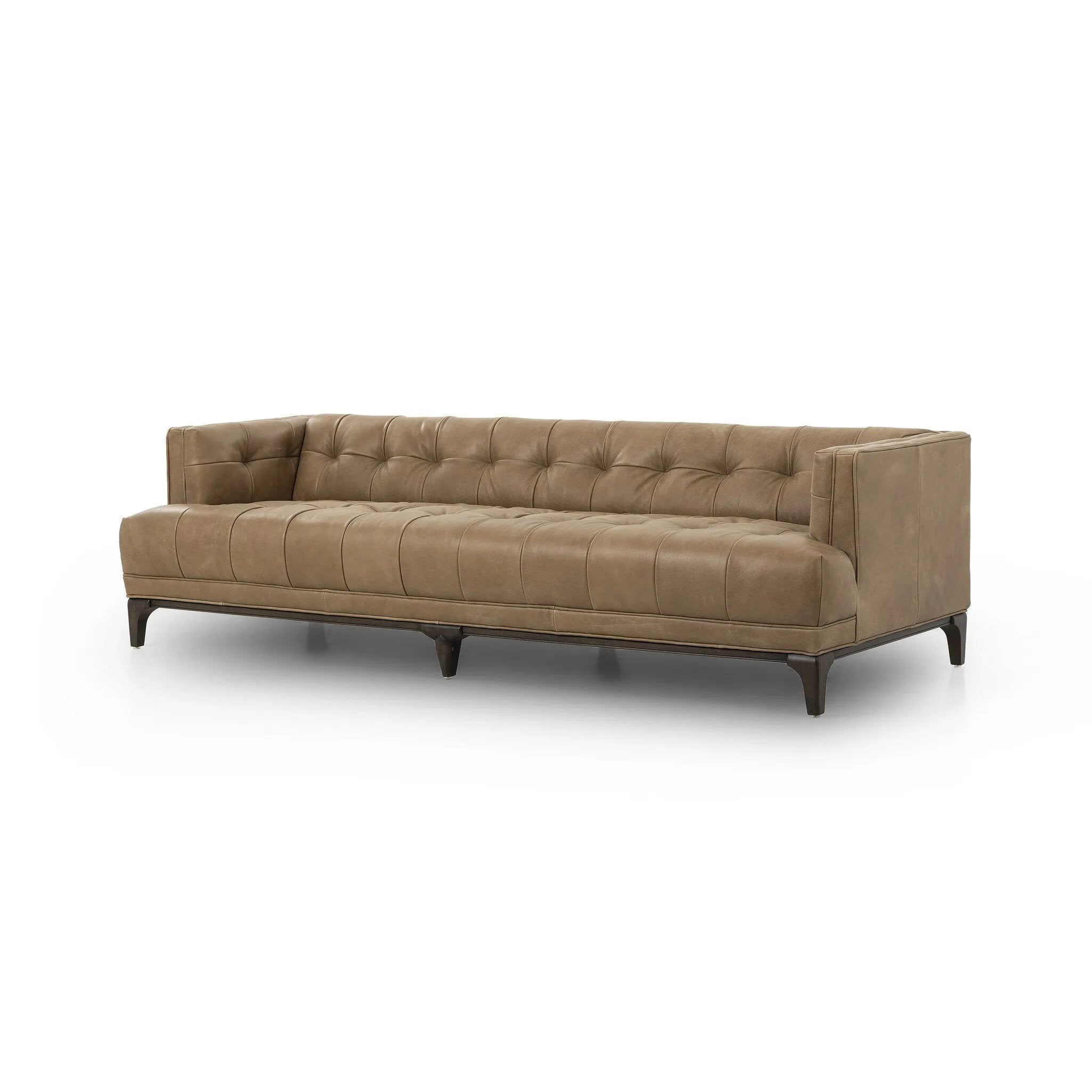 A modernized midcentury silhouette meets the traditional Chesterfield sofa, all in a compact profile perfect for smaller spaces. Top-grain leather in a tan hue, button tufting and a smooth touch bring deep comfort to lounging Amethyst Home provides interior design, new home construction design consulting, vintage area rugs, and lighting in the Austin metro area.