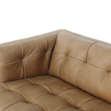 A modernized midcentury silhouette meets the traditional Chesterfield sofa, all in a compact profile perfect for smaller spaces. Top-grain leather in a tan hue, button tufting and a smooth touch bring deep comfort to lounging Amethyst Home provides interior design, new home construction design consulting, vintage area rugs, and lighting in the Nashville metro area.