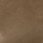 A modernized midcentury silhouette meets the traditional Chesterfield sofa, all in a compact profile perfect for smaller spaces. Top-grain leather in a tan hue, button tufting and a smooth touch bring deep comfort to lounging Amethyst Home provides interior design, new home construction design consulting, vintage area rugs, and lighting in the Seattle metro area.