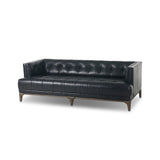 A modernized midcentury silhouette meets the traditional Chesterfield sofa, all in a compact profile perfect for smaller spaces. Top-grain leather in a classic black, button tufting and a smooth touch bring deep comfort to lounging Amethyst Home provides interior design, new home construction design consulting, vintage area rugs, and lighting in the Des Moines metro area.