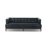 A modernized midcentury silhouette meets the traditional Chesterfield sofa, all in a compact profile perfect for smaller spaces. Top-grain leather in a classic black, button tufting and a smooth touch bring deep comfort to lounging Amethyst Home provides interior design, new home construction design consulting, vintage area rugs, and lighting in the Los Angeles metro area.