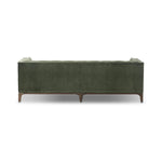A modernized midcentury silhouette meets the traditional Chesterfield sofa, all in a compact profile perfect for smaller spaces. Smooth velvet in an olive hue, button tufting and a soft touch bring deep comfort to lounging Amethyst Home provides interior design, new home construction design consulting, vintage area rugs, and lighting in the Laguna Beach metro area.