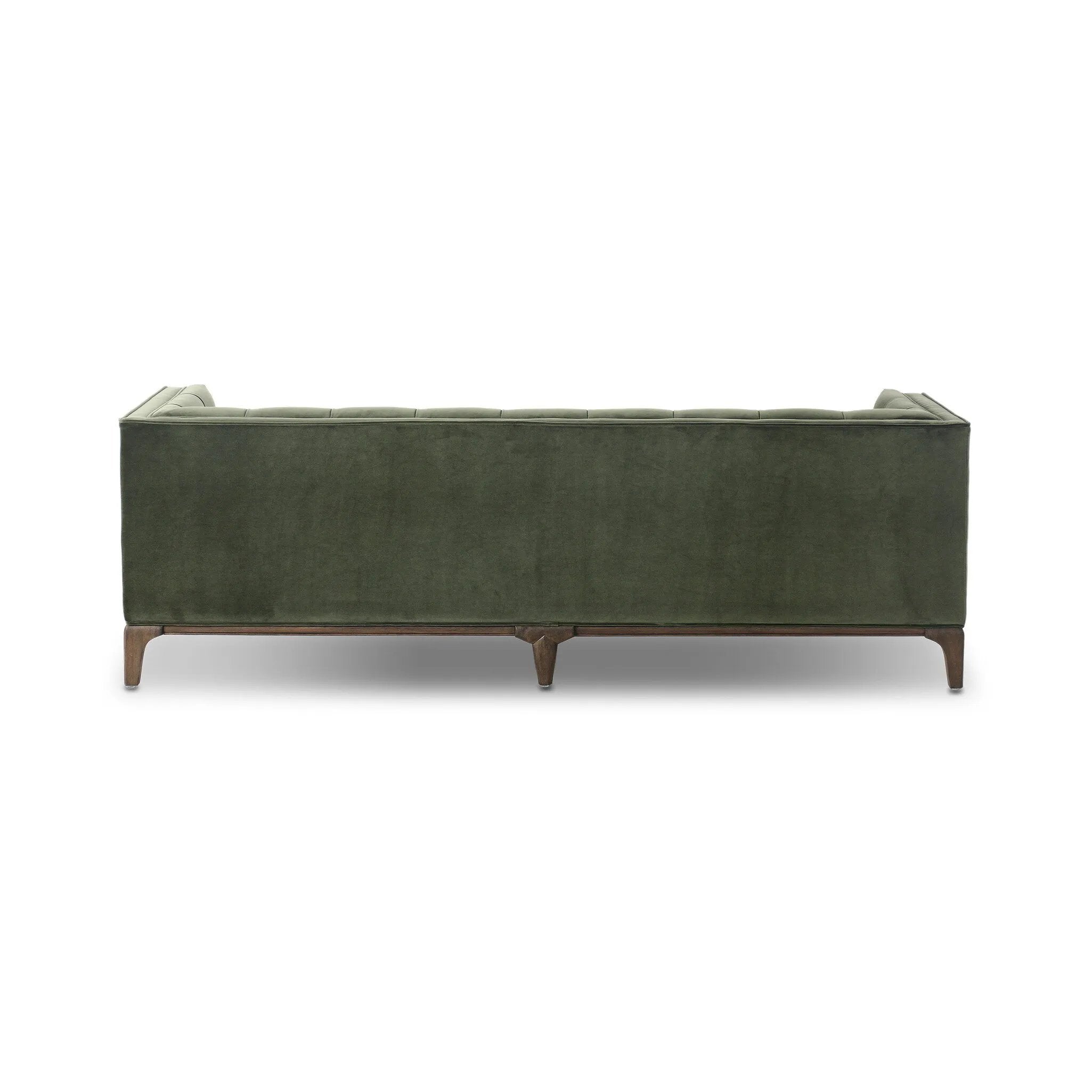 A modernized midcentury silhouette meets the traditional Chesterfield sofa, all in a compact profile perfect for smaller spaces. Smooth velvet in an olive hue, button tufting and a soft touch bring deep comfort to lounging Amethyst Home provides interior design, new home construction design consulting, vintage area rugs, and lighting in the Laguna Beach metro area.