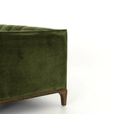 A modernized midcentury silhouette meets the traditional Chesterfield sofa, all in a compact profile perfect for smaller spaces. Smooth velvet in an olive hue, button tufting and a soft touch bring deep comfort to lounging Amethyst Home provides interior design, new home construction design consulting, vintage area rugs, and lighting in the Newport Beach metro area.