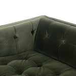 A modernized midcentury silhouette meets the traditional Chesterfield sofa, all in a compact profile perfect for smaller spaces. Smooth velvet in an olive hue, button tufting and a soft touch bring deep comfort to lounging Amethyst Home provides interior design, new home construction design consulting, vintage area rugs, and lighting in the Seattle metro area.