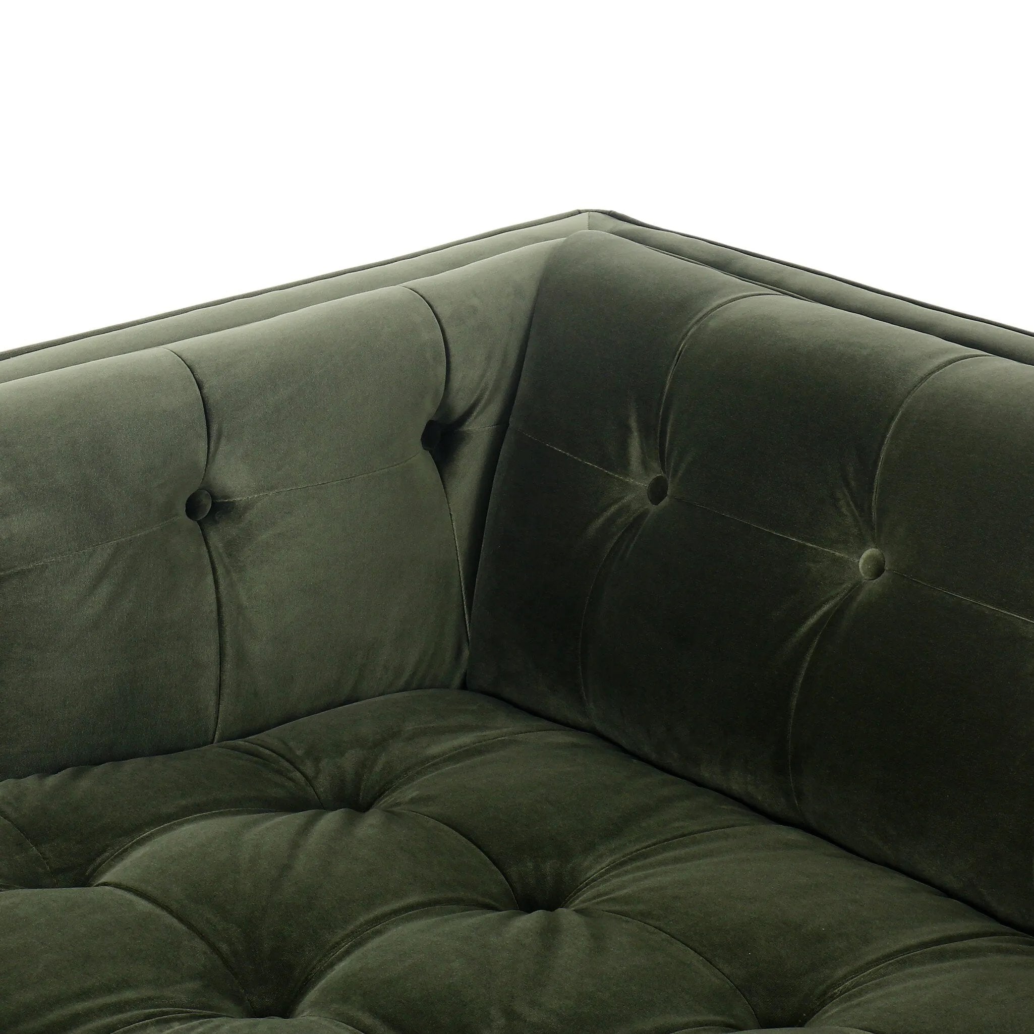 A modernized midcentury silhouette meets the traditional Chesterfield sofa, all in a compact profile perfect for smaller spaces. Smooth velvet in an olive hue, button tufting and a soft touch bring deep comfort to lounging Amethyst Home provides interior design, new home construction design consulting, vintage area rugs, and lighting in the Seattle metro area.