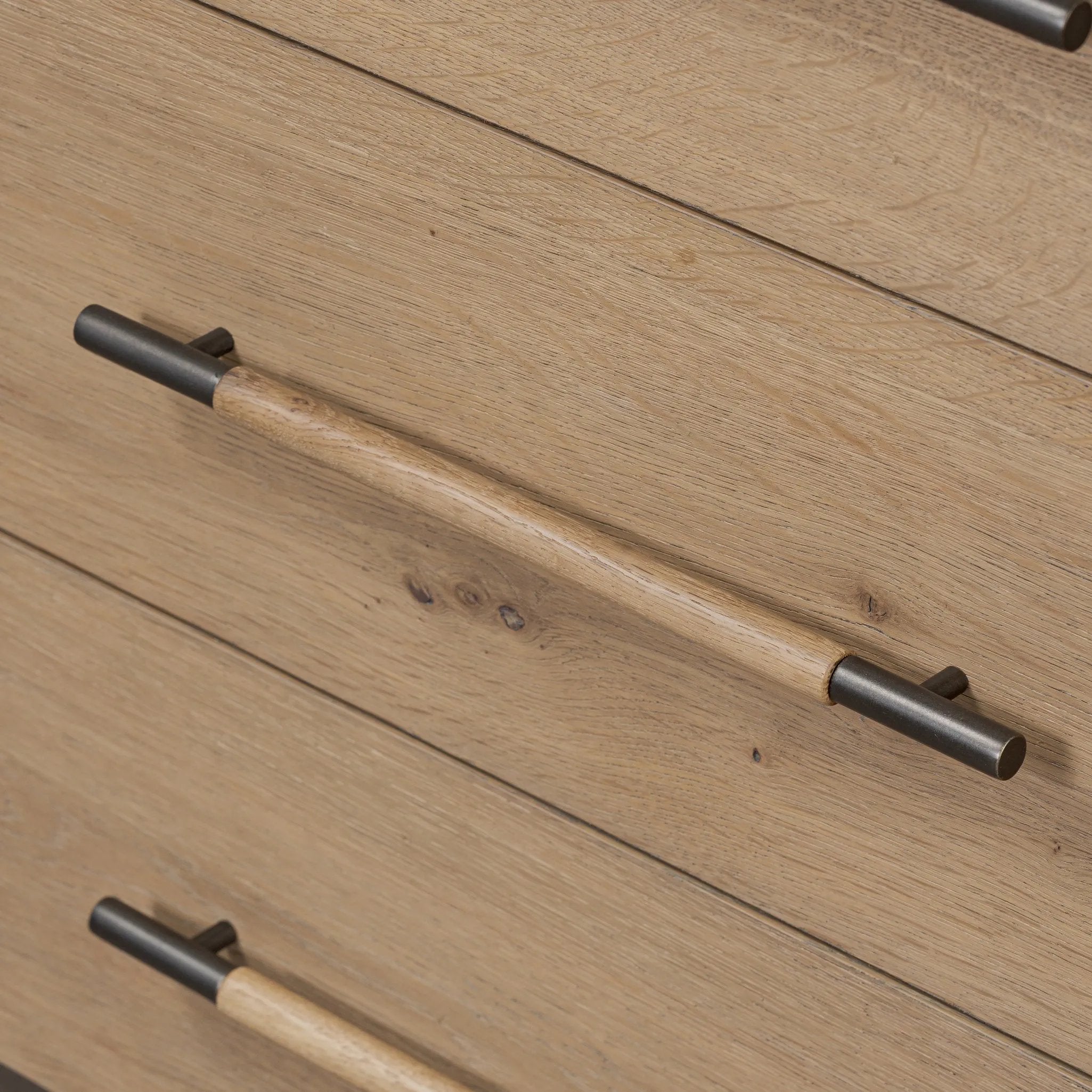 Simple and spacious, this oak dresser has six drawers paired with aged bronze and wood hardware. Waterfall shaping and soft-close undermount glides give a smooth finish Amethyst Home provides interior design, new home construction design consulting, vintage area rugs, and lighting in the Washington metro area.