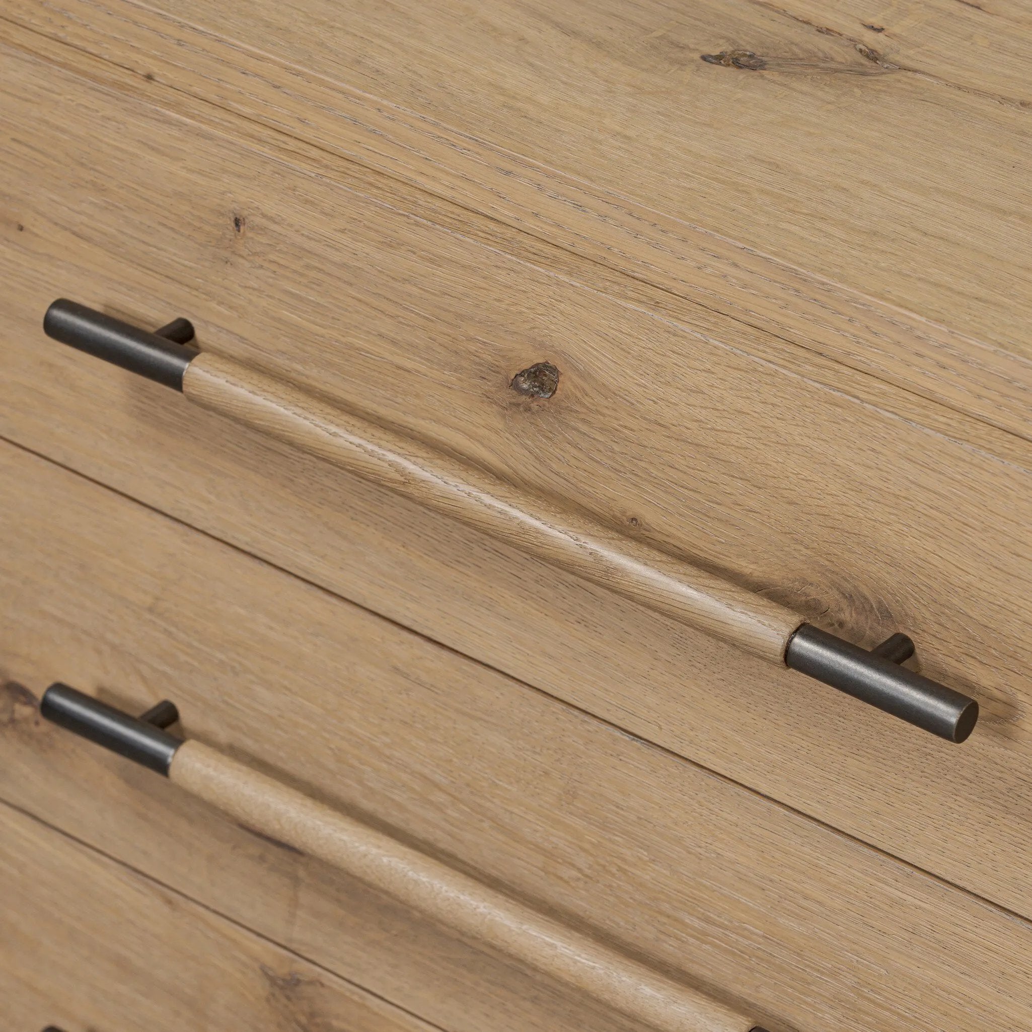 Simple and spacious, this oak nightstand has six drawers paired with aged bronze and wood hardware. Waterfall shaping and soft-close undermount glides give a smooth finish Amethyst Home provides interior design, new home construction design consulting, vintage area rugs, and lighting in the Monterey metro area.