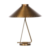 An antique brass iron dome is polished and finished with a perforated edge all around to bring a dose of industrial styling to this midcentury-inspired table lamp Amethyst Home provides interior design, new home construction design consulting, vintage area rugs, and lighting in the Austin metro area.