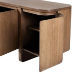 A clean-styled media console made from warm, grain-rich oak. Six doors feature subtle finger grooves for easy open. Gentle curves soften up the look, while a floating design keeps things feeling light and fresh. Inside, generous shelving awaits storage of media and more. Amethyst Home provides interior design, new home construction design consulting, vintage area rugs, and lighting in the Dallas metro area.