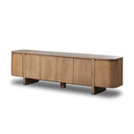 A clean-styled media console made from warm, grain-rich oak. Six doors feature subtle finger grooves for easy open. Gentle curves soften up the look, while a floating design keeps things feeling light and fresh. Inside, generous shelving awaits storage of media and more. Amethyst Home provides interior design, new home construction design consulting, vintage area rugs, and lighting in the Portland metro area.