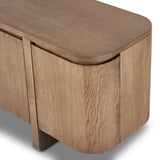 A clean-styled media console made from warm, grain-rich oak. Six doors feature subtle finger grooves for easy open. Gentle curves soften up the look, while a floating design keeps things feeling light and fresh. Inside, generous shelving awaits storage of media and more. Amethyst Home provides interior design, new home construction design consulting, vintage area rugs, and lighting in the Tampa metro area.