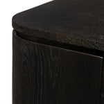 A clean-styled media console made from worn black oak. Six doors feature subtle finger grooves for easy open. Gentle curves soften up the look, while a floating design keeps things feeling light and fresh. Inside, generous shelving awaits storage of media and more. Amethyst Home provides interior design, new home construction design consulting, vintage area rugs, and lighting in the Dallas metro area.