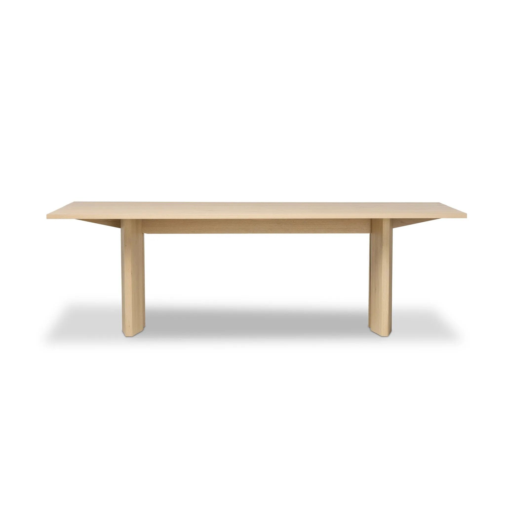 Thoughtful design details takes this long, linear dining table to the next level. Tapered shaping creates a clean, angular profile on the base, with splice leg detailing bringing a design-forward look to the whole piece. Fully crafted from bleached oak sourced from Romania. Amethyst Home provides interior design, new home construction design consulting, vintage area rugs, and lighting in the Boston metro area.