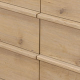 Built from thick-cut oak and veneers with an aged smoked finish, this farmhouse-inspired eight-drawer dresser features softened edges, fastening details, integrated wood hardware and soft-close drawer glides for quality construction Amethyst Home provides interior design, new home construction design consulting, vintage area rugs, and lighting in the Dallas metro area.