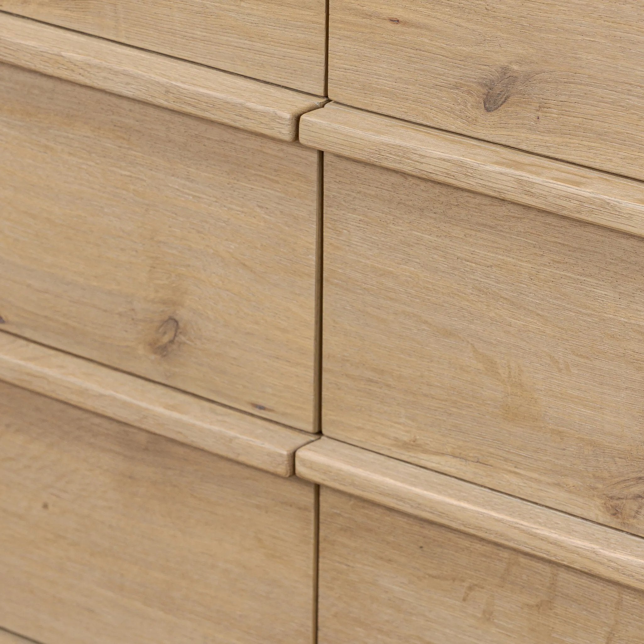 Built from thick-cut oak and veneers with an aged smoked finish, this farmhouse-inspired eight-drawer dresser features softened edges, fastening details, integrated wood hardware and soft-close drawer glides for quality construction Amethyst Home provides interior design, new home construction design consulting, vintage area rugs, and lighting in the Dallas metro area.