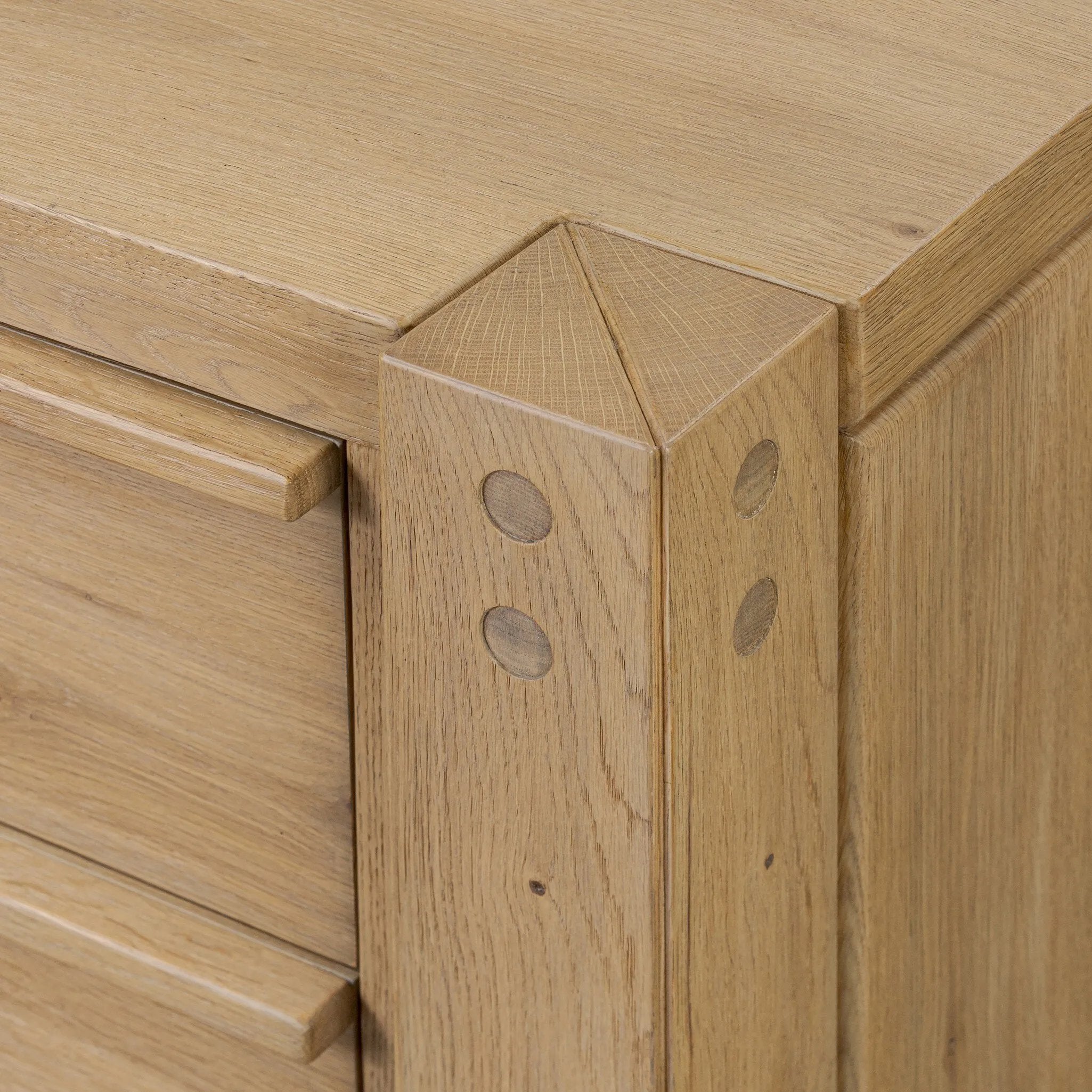 Built from thick-cut oak and veneers with an aged smoked finish, this farmhouse-inspired eight-drawer dresser features softened edges, fastening details, integrated wood hardware and soft-close drawer glides for quality construction Amethyst Home provides interior design, new home construction design consulting, vintage area rugs, and lighting in the Seattle metro area.