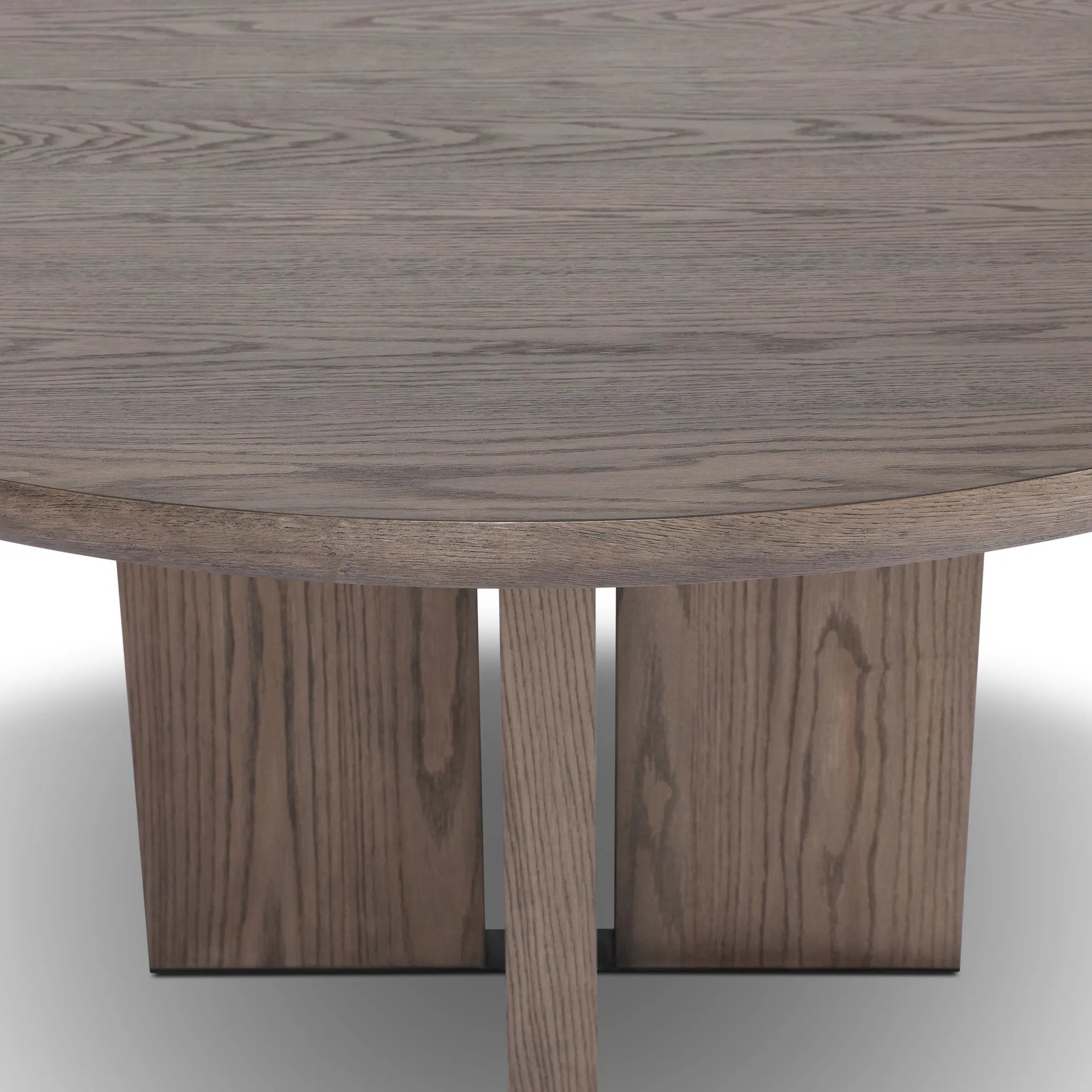 Inspired by minimalist Nordic design, a grey-finished oak dining table has a base of four plinth legs for a simple but impactful detail Amethyst Home provides interior design, new home construction design consulting, vintage area rugs, and lighting in the Des Moines metro area.