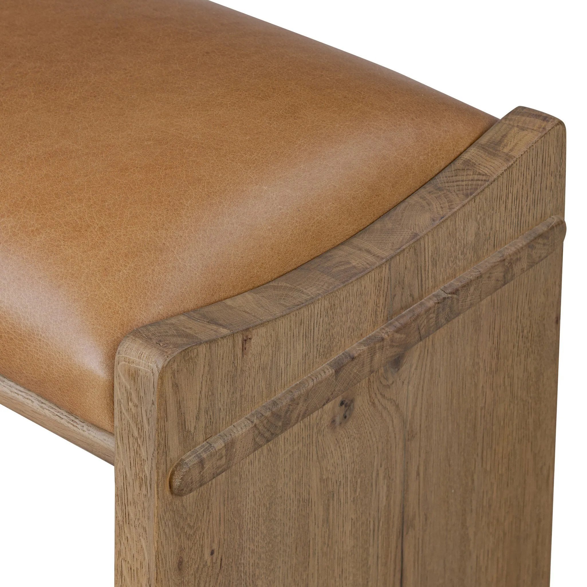 Top-grain leather and worn, solid oak fuse for a substantial, streamlined bench inspired by Nordic Minimalism Amethyst Home provides interior design, new home construction design consulting, vintage area rugs, and lighting in the Houston metro area.