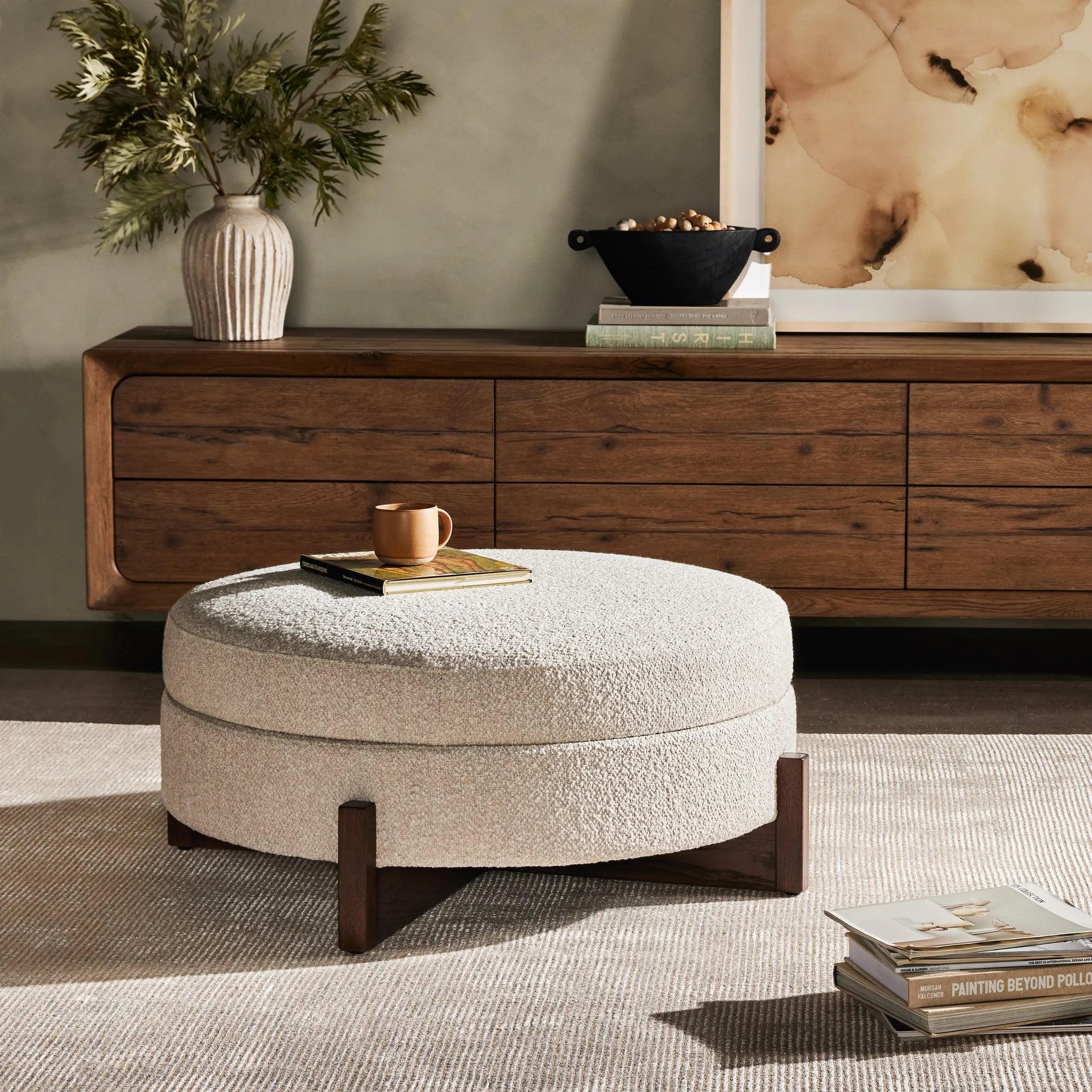 Featuring Esben Sattley Fog Storage Ottoman by Four Hands at Amethyst Home. Get extra storage and an extra spot for lounging or propped feet in one. This coffee table-sized storage ottoman features a loose top to store extra blankets and more. Upholstered in a textural boucle-like performance fabric, perfect for everyday messes. Finished with an X-frame parawoo. Amethyst Home provides interior design, new home construction design consulting, vintage area rugs, and lighting in the Tampa metro area.