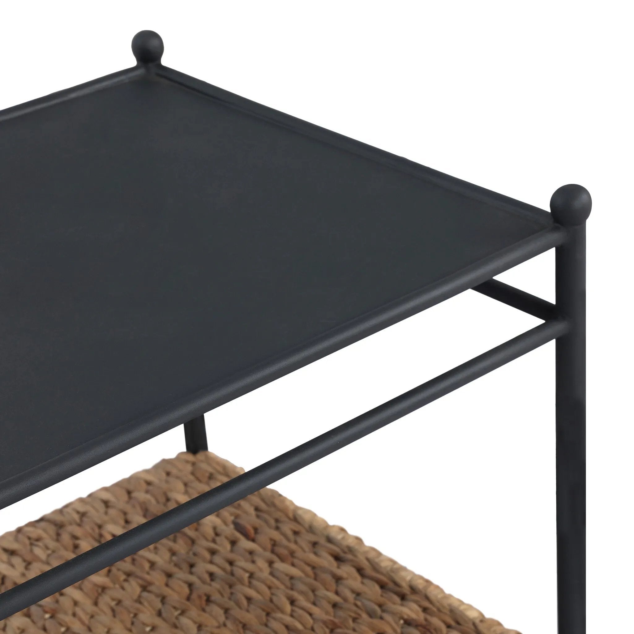 Work subtle coastal vibes into any room with this mixed-material end table, pairing woven hyacinth with charcoal-finished steel. Simplified heritage ball detailing on each leg adds a design-forward touch.As fans of organic modern aesthetics at Amethyst, we love the designer inspired Evanne End Table - Charcoal Iron. Amethyst Home provides interior design, new home construction design consulting, vintage area rugs, and lighting in the Charlotte metro area.