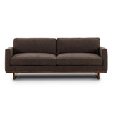 Classic goes contemporary. A brown-finished parawood base supports low, deep seating of high-performance fabric, with track arms for a clean touch.As enthusiasts of natural aesthetics at Amethyst, we love the warm modern inspired Everly Sofa - Landale Charcoal. This item pairs well with other brands such as Ethnicraft and is perfect for loft homes Amethyst Home provides interior design, new home construction design consulting, vintage area rugs, and lighting in the Alpharetta metro area.