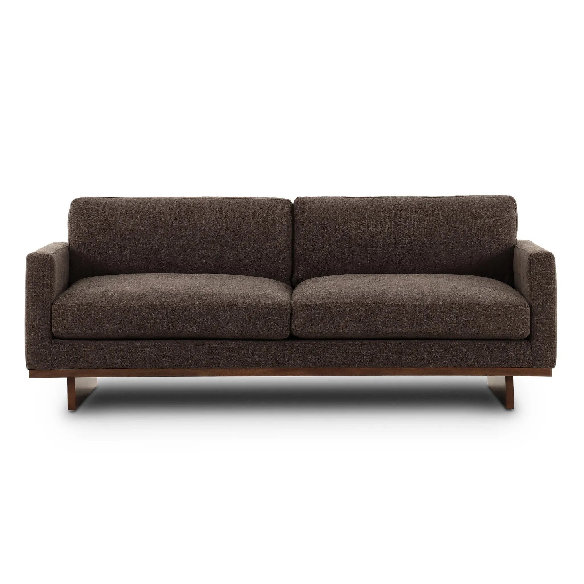 Classic goes contemporary. A brown-finished parawood base supports low, deep seating of high-performance fabric, with track arms for a clean touch.As enthusiasts of natural aesthetics at Amethyst, we love the warm modern inspired Everly Sofa - Landale Charcoal. This item pairs well with other brands such as Ethnicraft and is perfect for loft homes Amethyst Home provides interior design, new home construction design consulting, vintage area rugs, and lighting in the Alpharetta metro area.