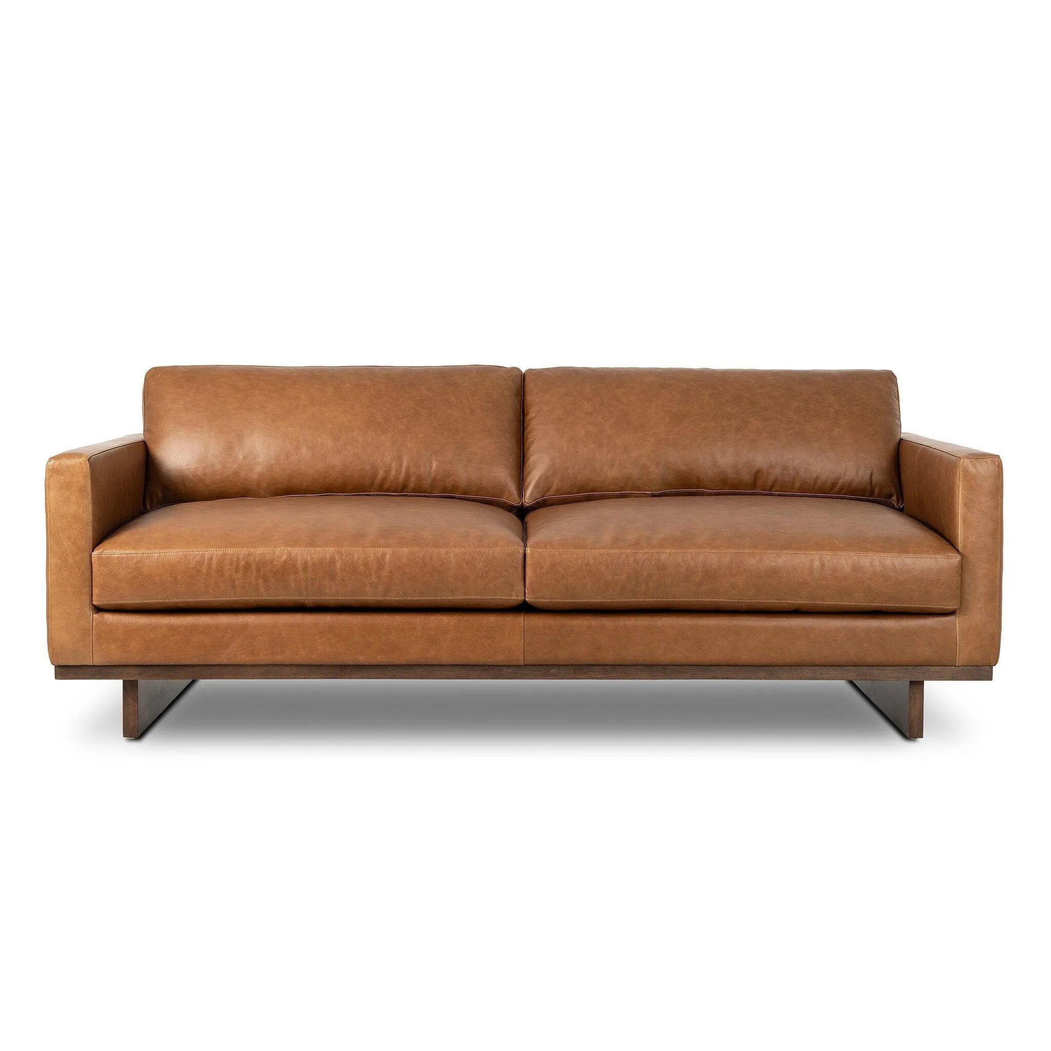 Classic goes contemporary. A brown-finished wood base supports low, deep seating of high-top-grain leather, with track arms for a clean touch.As fans of organic modern style at Amethyst, we love the nature inspired Everly Sofa - Sonoma Chestnut. This item pairs well with other brands such as Visual Comfort and is perfect for modern homes Amethyst Home provides interior design, new home construction design consulting, vintage area rugs, and lighting in the Alpharetta metro area.