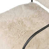 A textural take on a timeless silhouette. Hammered iron frames a squared seat and bolster back upholstered in off-white Mongolian fur Amethyst Home provides interior design, new home construction design consulting, vintage area rugs, and lighting in the Laguna Beach metro area.