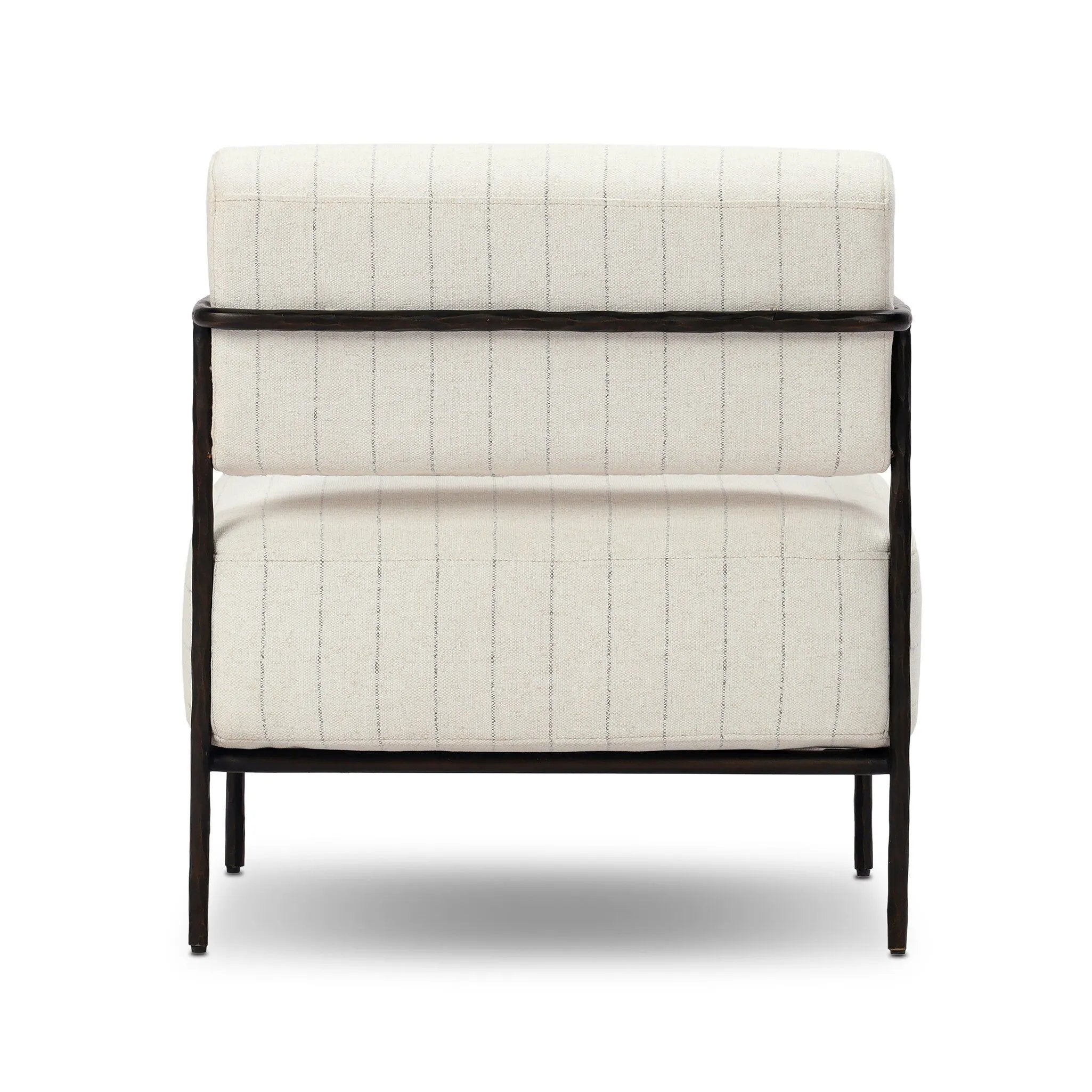 A slim take on a timeless silhouette. Hammered iron frames a squared seat and bolster back upholstered in striped, neutral fabric. Cover or store inside during inclement weather and when not in use.As enthusiasts of organic modern style at Amethyst, we love the nature inspired Fenn Outdoor Chair - Amalfi Natural. Amethyst Home provides interior design, new home construction design consulting, vintage area rugs, and lighting in the Laguna Beach metro area.