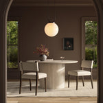 Mixed materials at their finest. Brown parawood forms a slight, simple frame for squared seating of neutral performance-grade upholstery. Charcoal top-grain leather backing takes this modern-minded dining chair to the next level Amethyst Home provides interior design, new home construction design consulting, vintage area rugs, and lighting in the San Diego metro area.