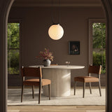 Mixed materials at their finest. Brown parawood forms a slight, simple frame for squared seating of neutral performance-grade upholstery. Charcoal top-grain leather backing takes this modern-minded dining chair to the next level Amethyst Home provides interior design, new home construction design consulting, vintage area rugs, and lighting in the Los Angeles metro area.