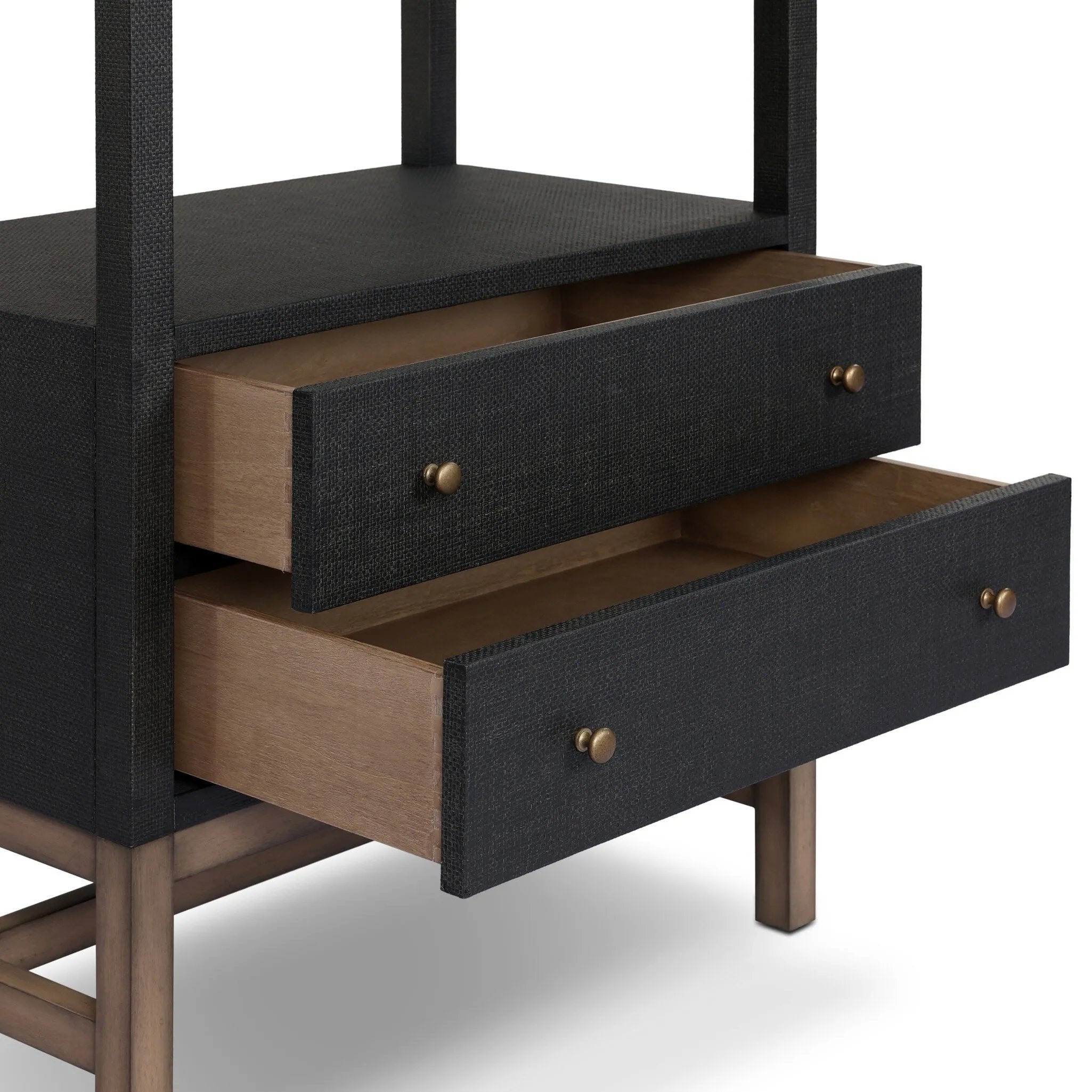 Woven black raffia drawers offer closed storage and a texture-driven take on book shelving. Antique brass-finished hardware adds a touch of vintage detailing, all framed within solid mahogany Amethyst Home provides interior design, new home construction design consulting, vintage area rugs, and lighting in the Charlotte metro area.