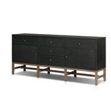 Featuring Fiona Russet Mahogany Sideboard by Four Hands at Amethyst Home. Woven black raffia places a texture-driven twist on sideboard storage. Five roomy drawers and two cabinets feature simple hardware finished in an antique brass, all supported by an open, airy base of solid mahogany.Overall Dimensions: 78.00"w x 18.00"d x 34.50"hWeight : 197.75 lbsMate. Amethyst Home provides interior design, new home construction design consulting, vintage area rugs, and lighting in the Calabasas metro area.