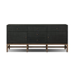 Featuring Fiona Russet Mahogany Sideboard by Four Hands at Amethyst Home. Woven black raffia places a texture-driven twist on sideboard storage. Five roomy drawers and two cabinets feature simple hardware finished in an antique brass, all supported by an open, airy base of solid mahogany.Overall Dimensions: 78.00"w x 18.00"d x 34.50"hWeight : 197.75 lbsMate. Amethyst Home provides interior design, new home construction design consulting, vintage area rugs, and lighting in the Charlotte metro area.