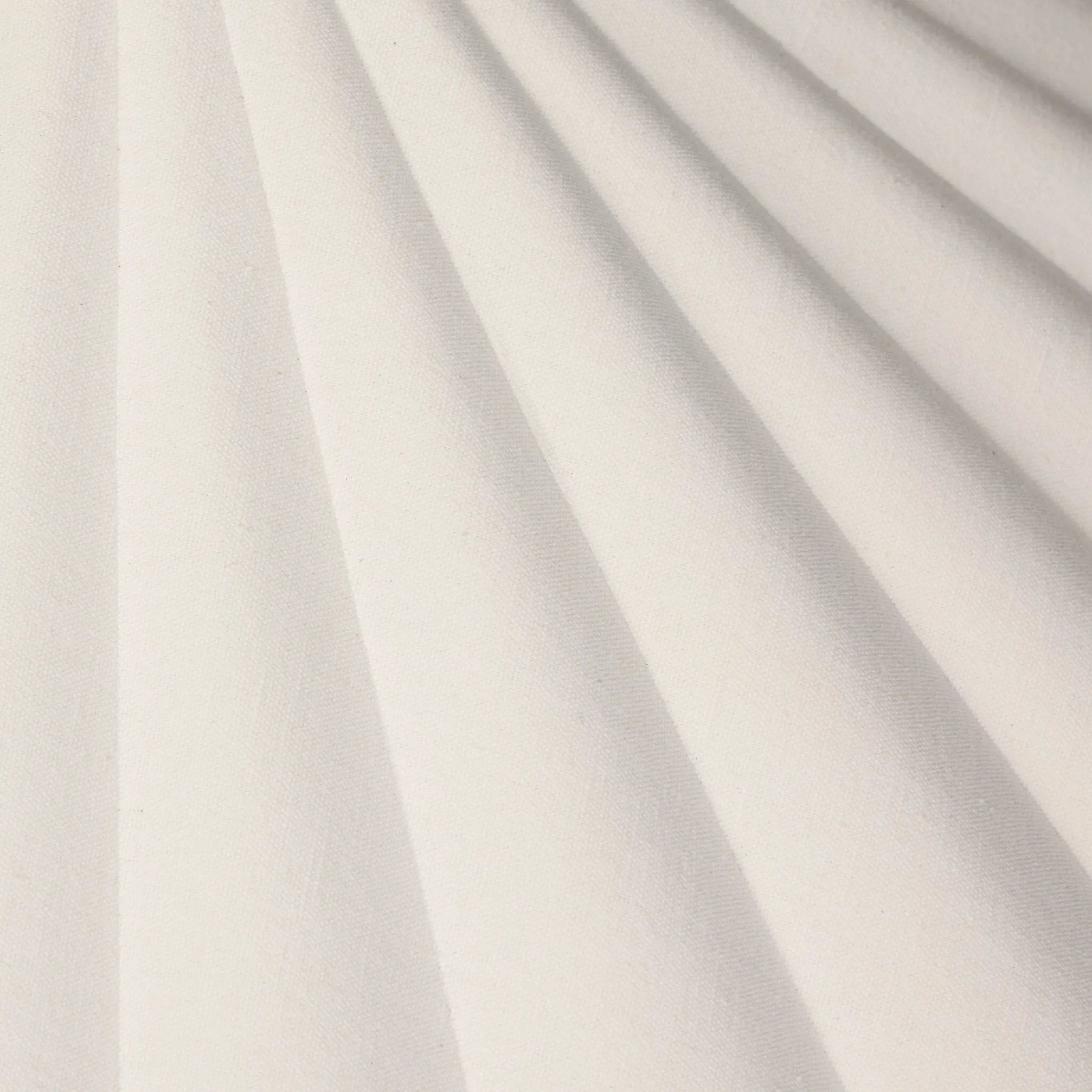 Textures and contrasting hues unite for this pendant's beautiful glow. The overscale scalloped shade features a creamy white canvas exterior covering a dark, antiqued brass interior, and a wrought iron chain for maximum drama Amethyst Home provides interior design, new home construction design consulting, vintage area rugs, and lighting in the Des Moines metro area.