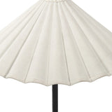 Textures and contrasting hues unite for this table lamp's beautiful glow. The overscale scalloped shade features a creamy white canvas exterior covering an antiqued brass interior, and wrought iron pull chains adjust each lightbulb in Baroque-era form Amethyst Home provides interior design, new home construction design consulting, vintage area rugs, and lighting in the Laguna Beach metro area.