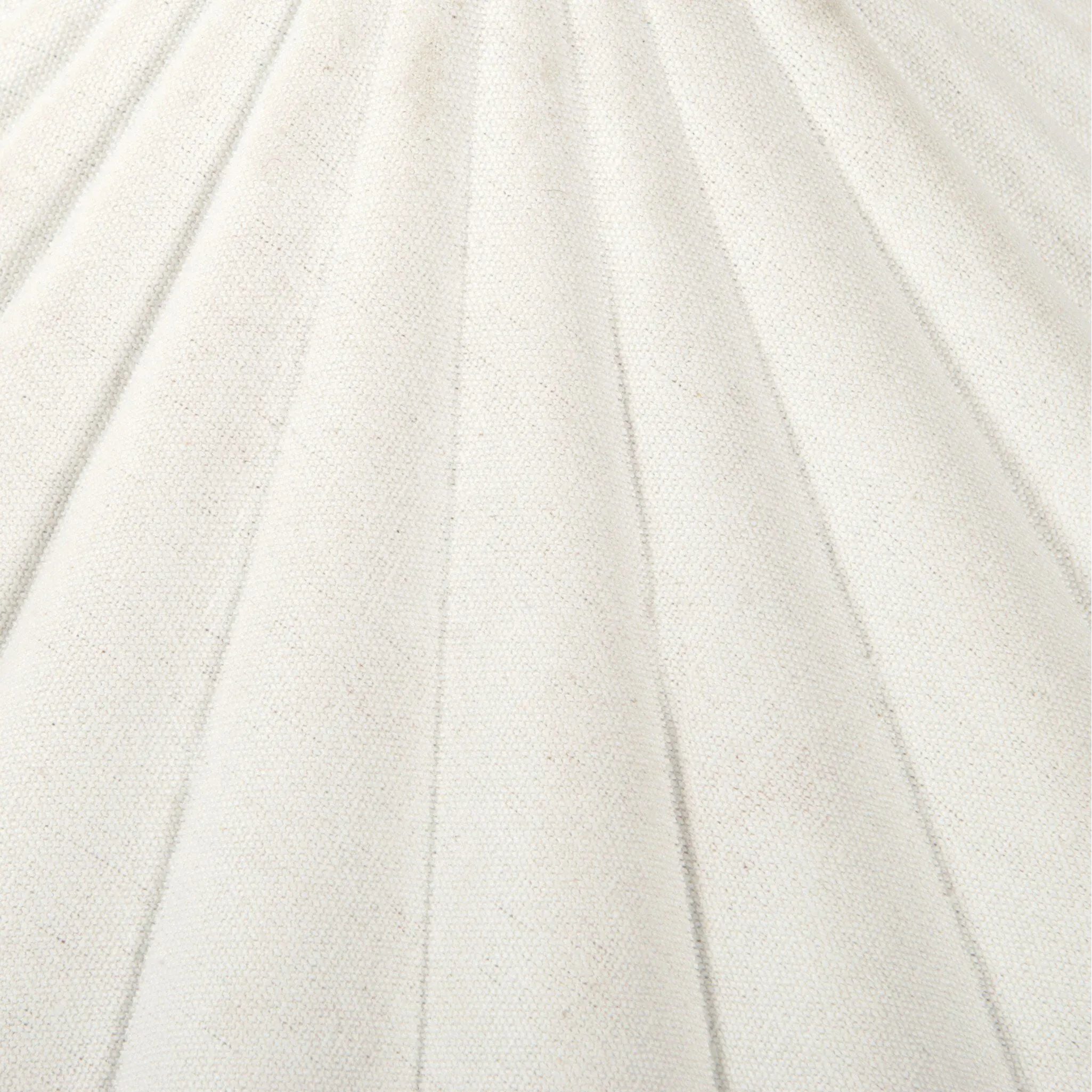 Textures and contrasting hues unite for this table lamp's beautiful glow. The overscale scalloped shade features a creamy white canvas exterior covering an antiqued brass interior, and wrought iron pull chains adjust each lightbulb in Baroque-era form Amethyst Home provides interior design, new home construction design consulting, vintage area rugs, and lighting in the Seattle metro area.