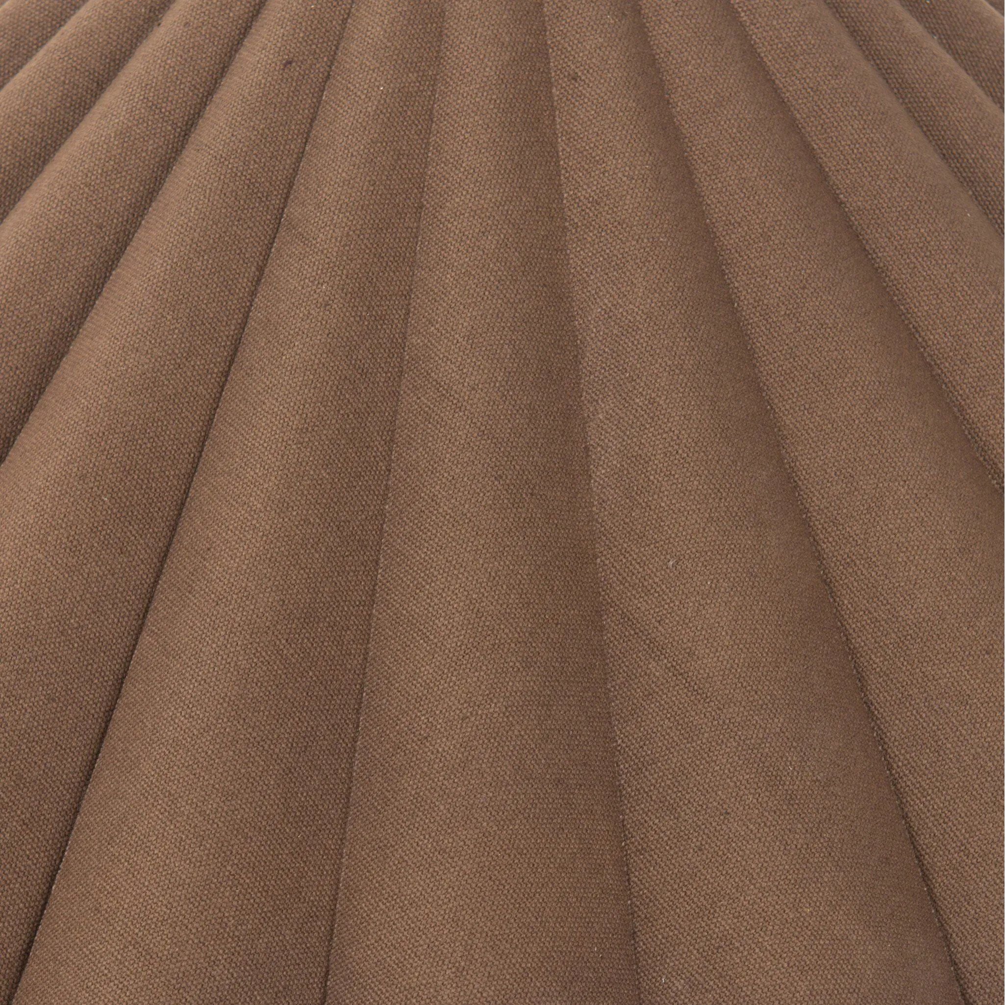 Textures and deep hues unite for this table lamp's beautiful glow. The overscale scalloped shade features a dark canvas exterior covering an antiqued brass interior, and wrought iron pull chains adjust each lightbulb in Baroque-era form Amethyst Home provides interior design, new home construction design consulting, vintage area rugs, and lighting in the Boston metro area.