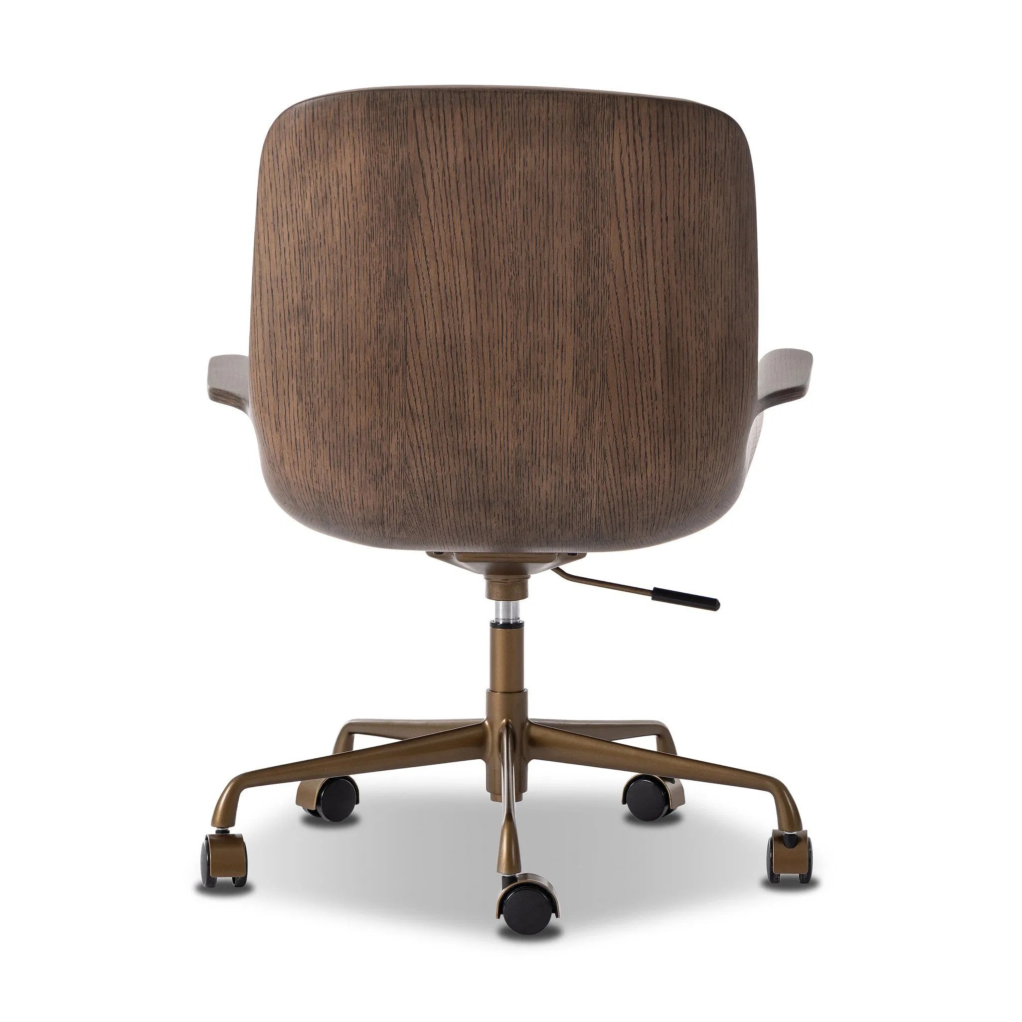 Elevate the office with one easy piece. Inspired by midcentury molded plywood chairs, brown oak veneer frames top-grain leather seat cushioning with slim, soft channeling. A 360-degree swivel burnished brass-finished base with casters allows for easy movement. Amethyst Home provides interior design, new home construction design consulting, vintage area rugs, and lighting in the Scottsdale metro area.