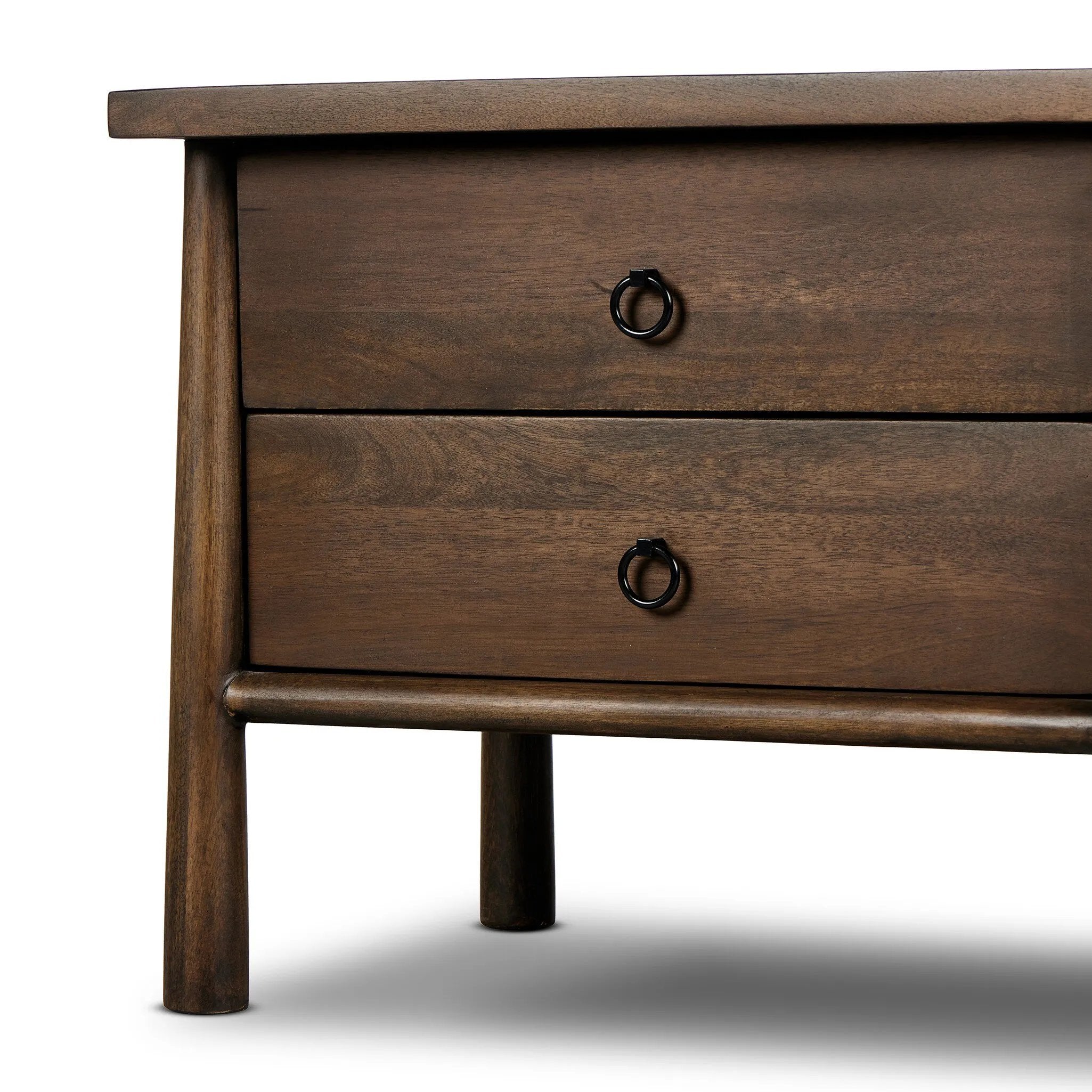 Inspired by French antique design, this dresser stands on round tapered legs with a prominent overhang top. Made of mango wood with cast iron key ring pulls, two drawers make it a versatile choice as a dresser or nightstand.Collection: May Amethyst Home provides interior design, new home construction design consulting, vintage area rugs, and lighting in the Seattle metro area.