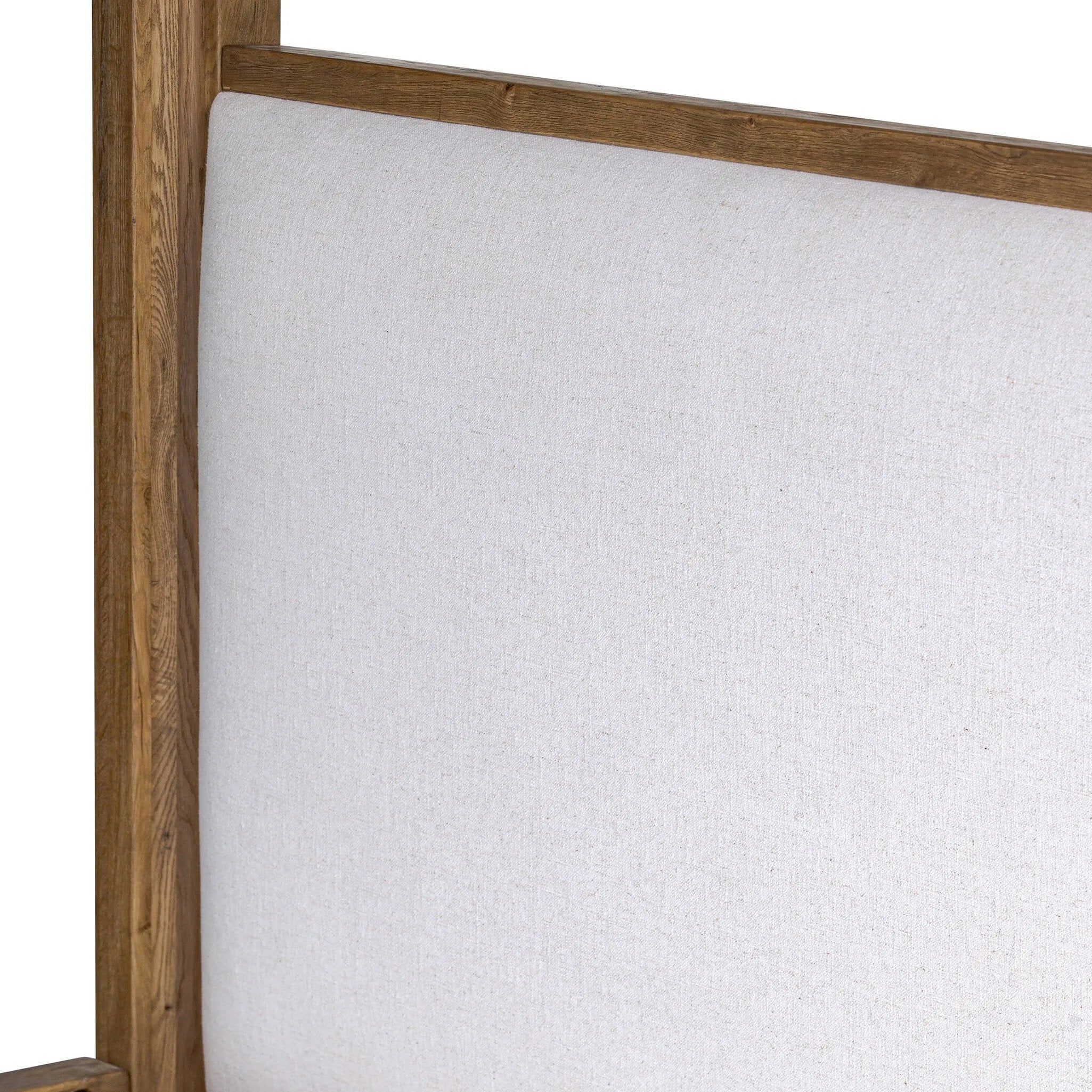 Minimalist and modern, this platform-style canopy bed is framed to a low profile and softened with an upholstered headboard. 