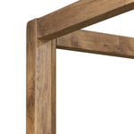 Minimalist and modern, this platform-style canopy bed is framed to a low profile and softened with an upholstered headboard. 