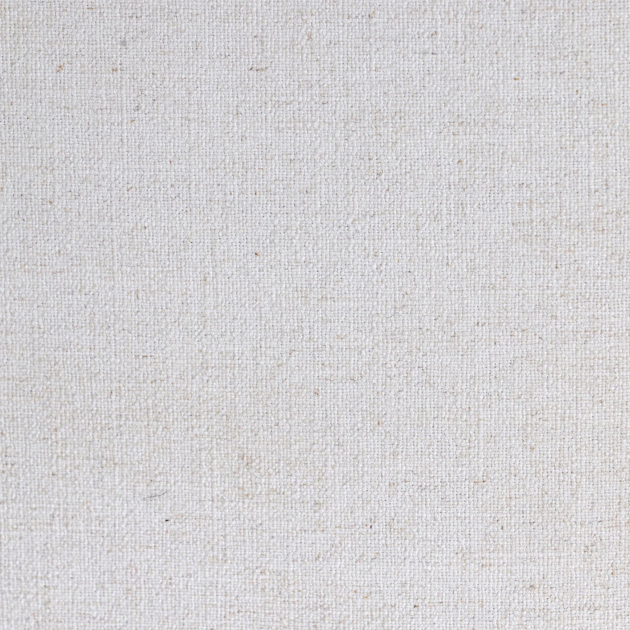 Minimalist and modern, this platform-style canopy bed is framed to a low profile and softened with an upholstered headboard. 