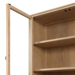 Traditional design defines this light-finished oak cabinet. Simple, clean side panels highlight a softly curved bottom frame. Steel handles in a copper patina finish add a unique touch.As fans of wabi sabi design at Amethyst, we love the nature inspired Gates Cabinet - Light Natural Oak Veneer. Amethyst Home provides interior design, new home construction design consulting, vintage area rugs, and lighting in the Los Angeles metro area.